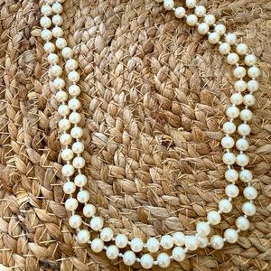 Double strand imitation pearl strand necklace.